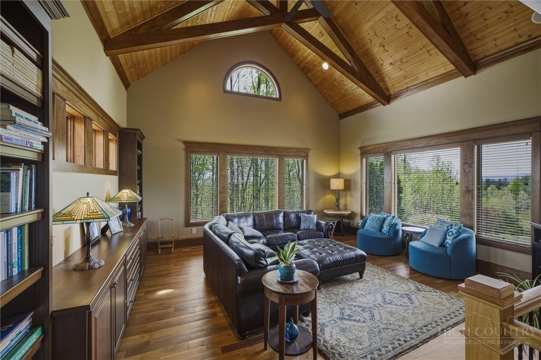 1638 Johns Ridge Parkway Lenoir, NC 28645 - Photo 4 of 50 a living room with furniture and a floor to ceiling window
