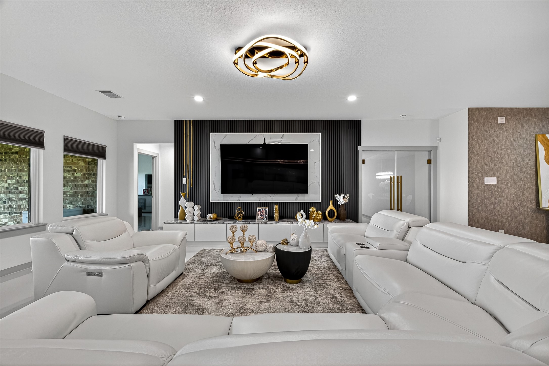31410 Hexan Heights Lane Fulshear, TX 77441 - Photo 15 of 50 a living room with furniture and a flat screen tv