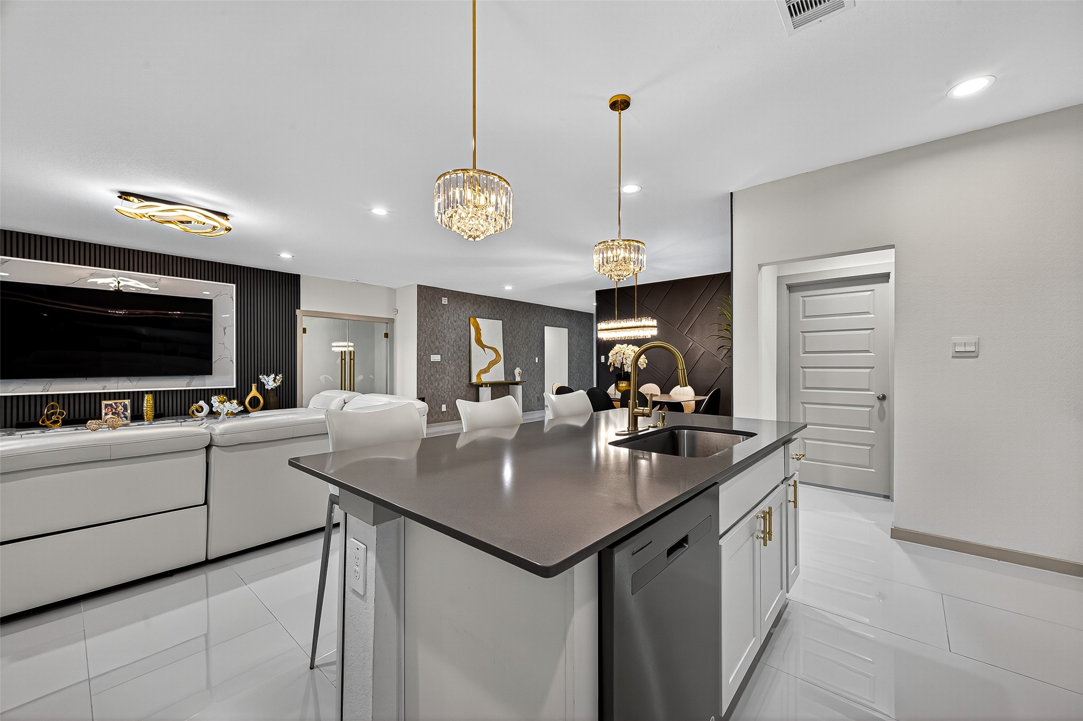 31410 Hexan Heights Lane Fulshear, TX 77441 - Photo 19 of 50 a kitchen with stainless steel appliances granite countertop a sink a stove and a wooden floors