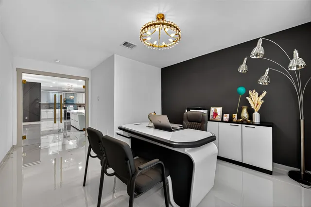 a view of a dining table and chairs in a room