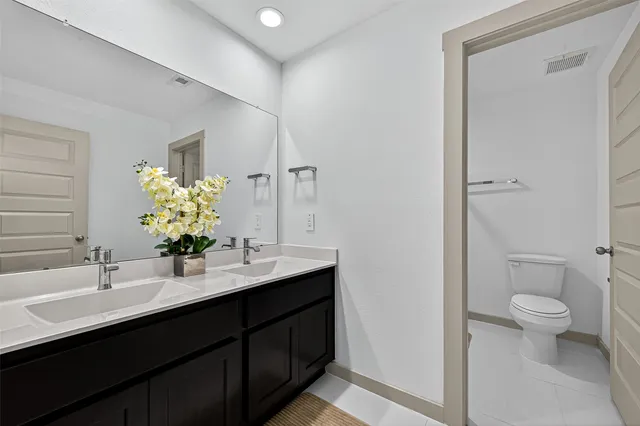 a dining room with a table and chairs