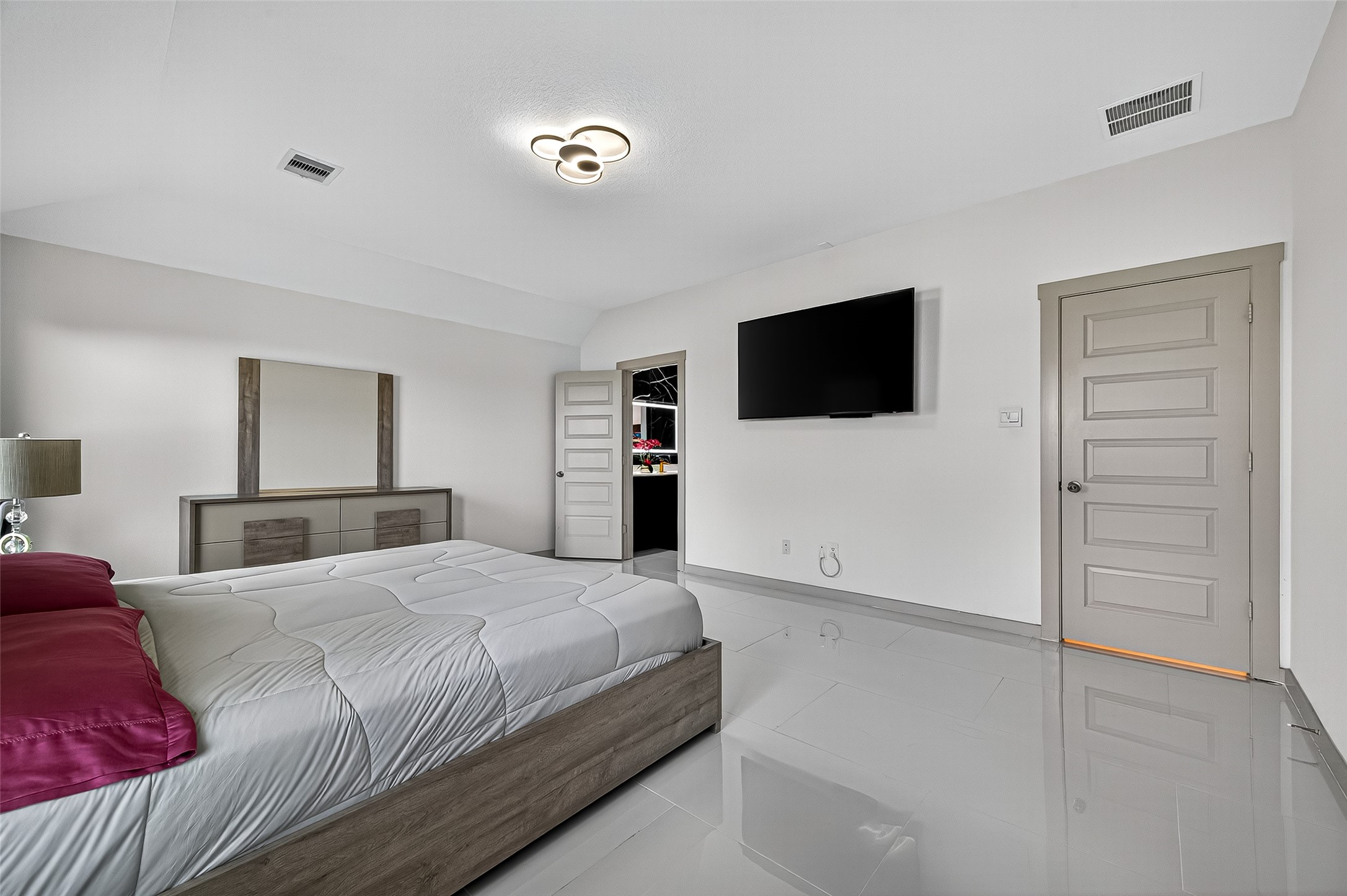 31410 Hexan Heights Lane Fulshear, TX 77441 - Photo 32 of 50 a bedroom with a bed and a flat screen tv