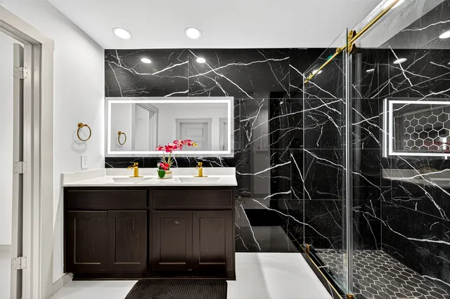 a kitchen with a sink appliances and cabinets