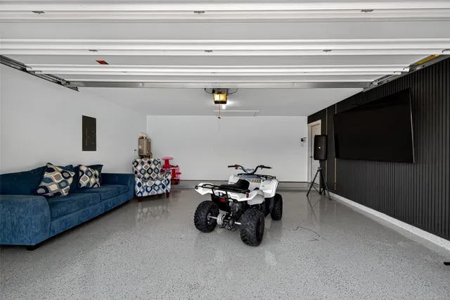 a bathroom with a sink mirror and a shower