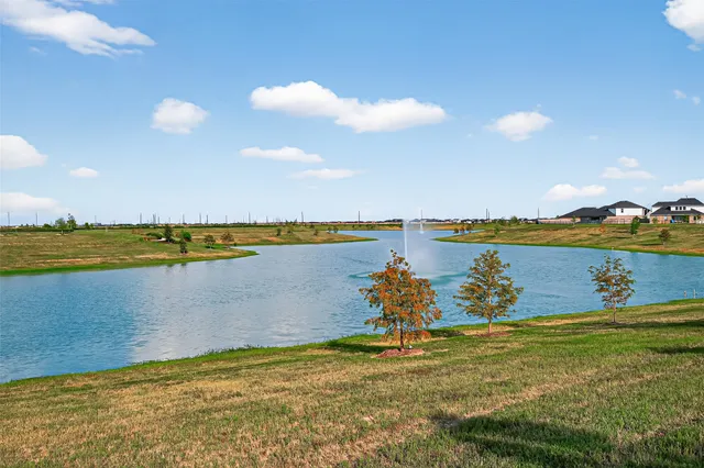 a view of a lake and a yard