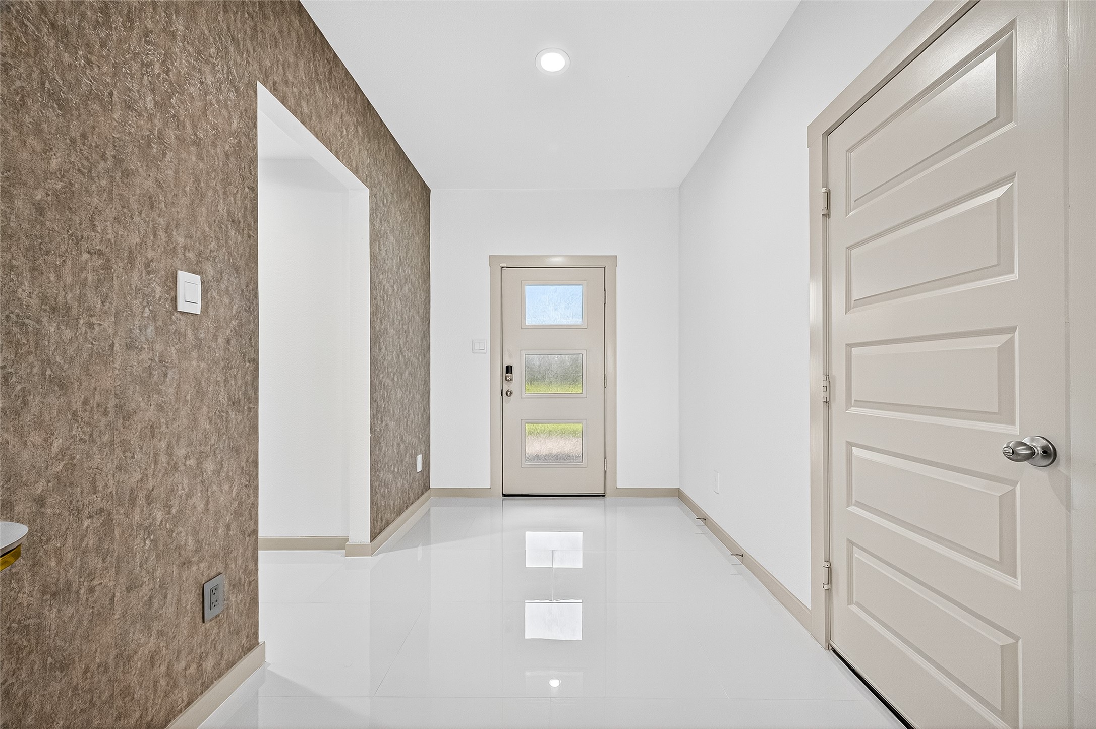 31410 Hexan Heights Lane Fulshear, TX 77441 - Photo 7 of 50 a view of a hallway with wooden door