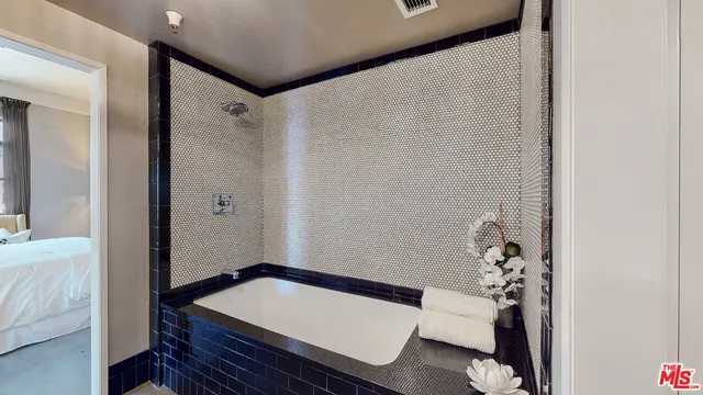 a room with a table and a chandelier