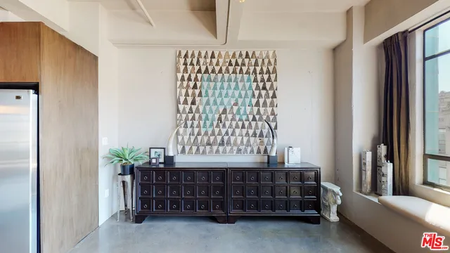 a living room with furniture and a piano