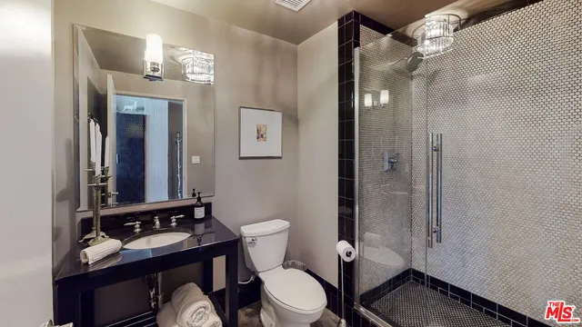 a spacious bathroom with a double vanity sink and a mirror