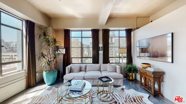 a living room with furniture and a window