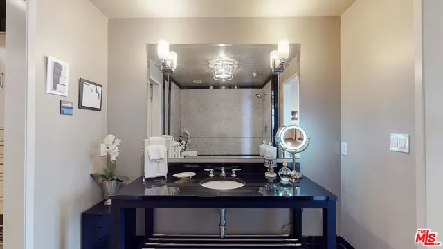 a bathroom with a sink and a mirror