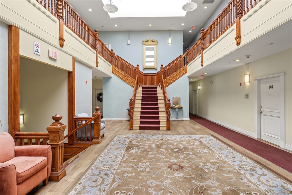 7 Main Street, Unit 102 Brockton, MA 02301 - Photo 2 of 31 a very nice looking room with windows and stairs
