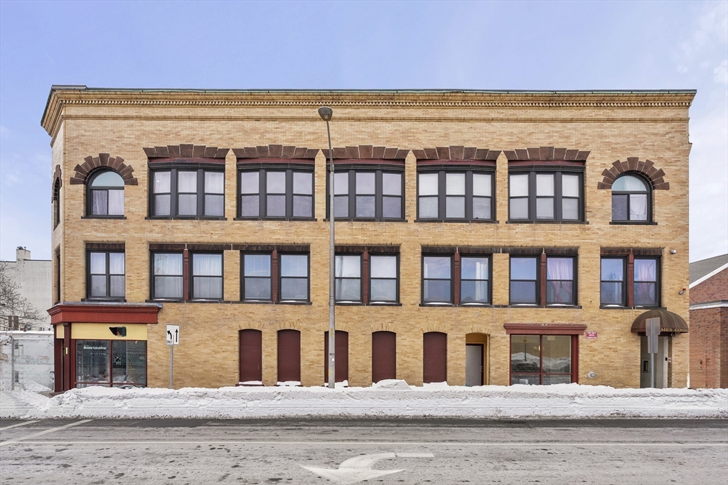 7 Main Street, Unit 102 Brockton, MA 02301 - Photo 27 of 31 a front view of a building with a garden