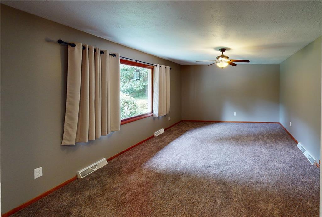 2234 Branchton Road Hilliards, PA 16040 - Photo 4 of 34 an empty room with windows and chandelier fan