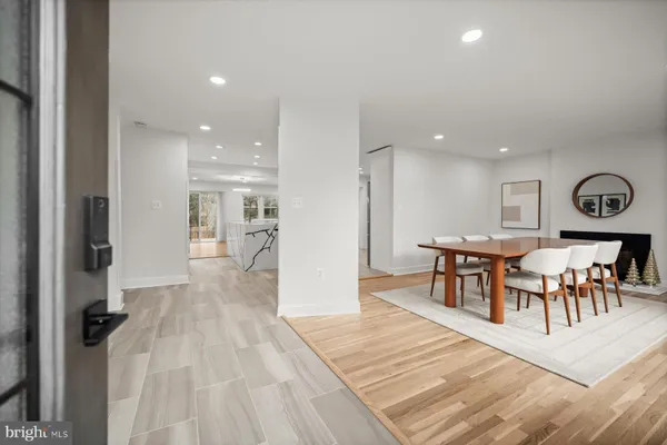 a view of a dining area with furniture and wooden floor