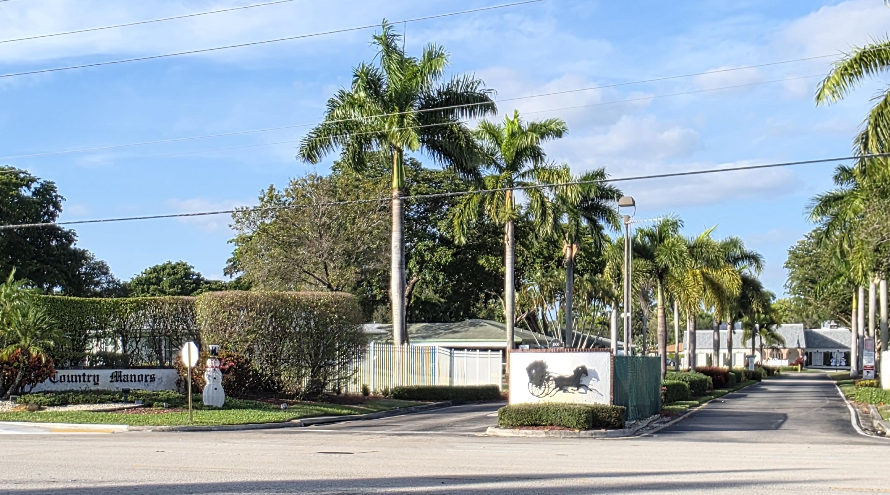 718 Whippoorwill Lane Delray Beach, FL 33445 - Photo 2 of 37 Country Manors Entrance