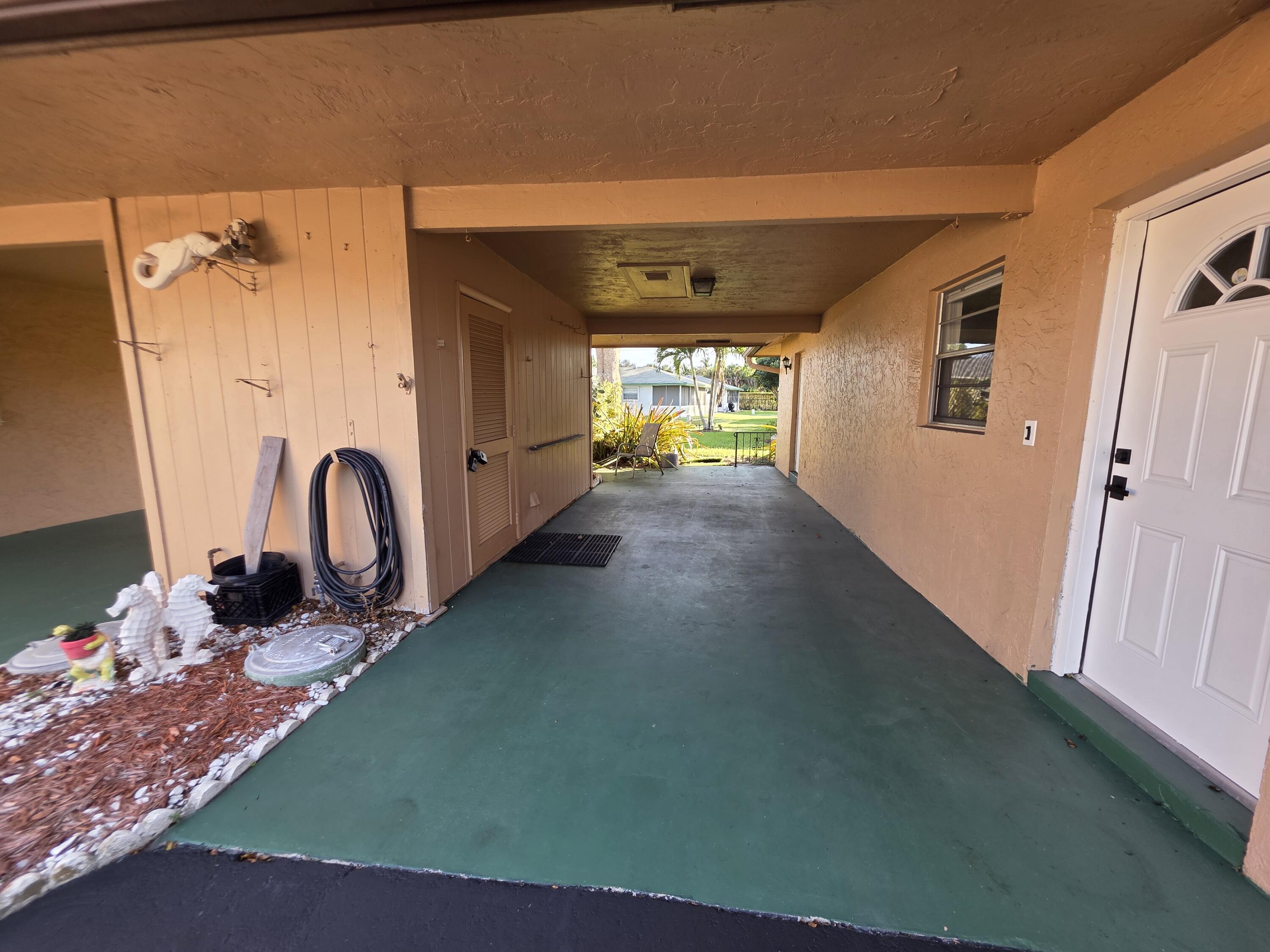 718 Whippoorwill Lane Delray Beach, FL 33445 - Photo 28 of 37 Carport