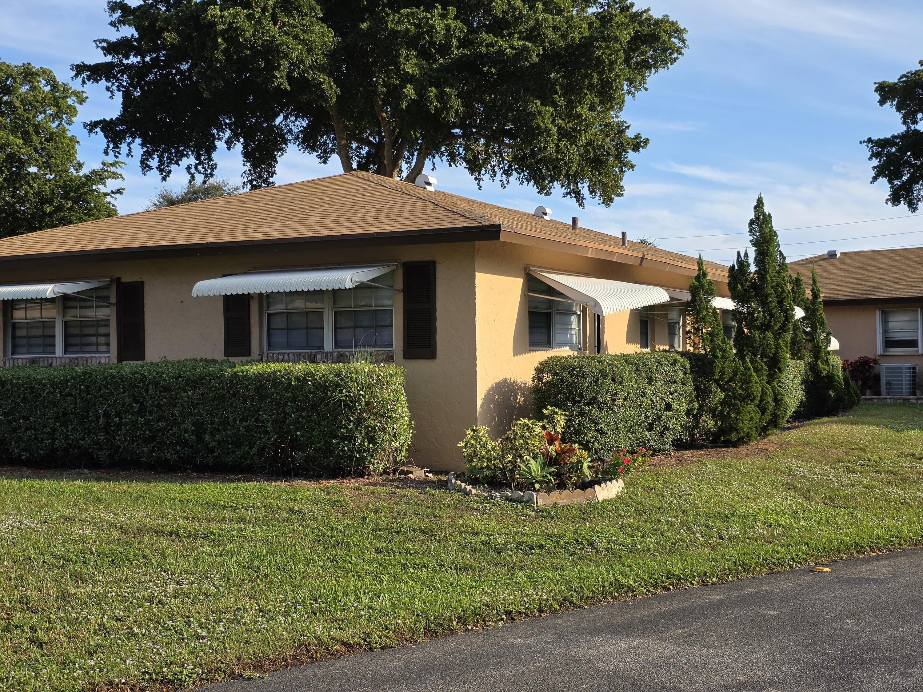 718 Whippoorwill Lane Delray Beach, FL 33445 - Photo 3 of 37 View form the street
