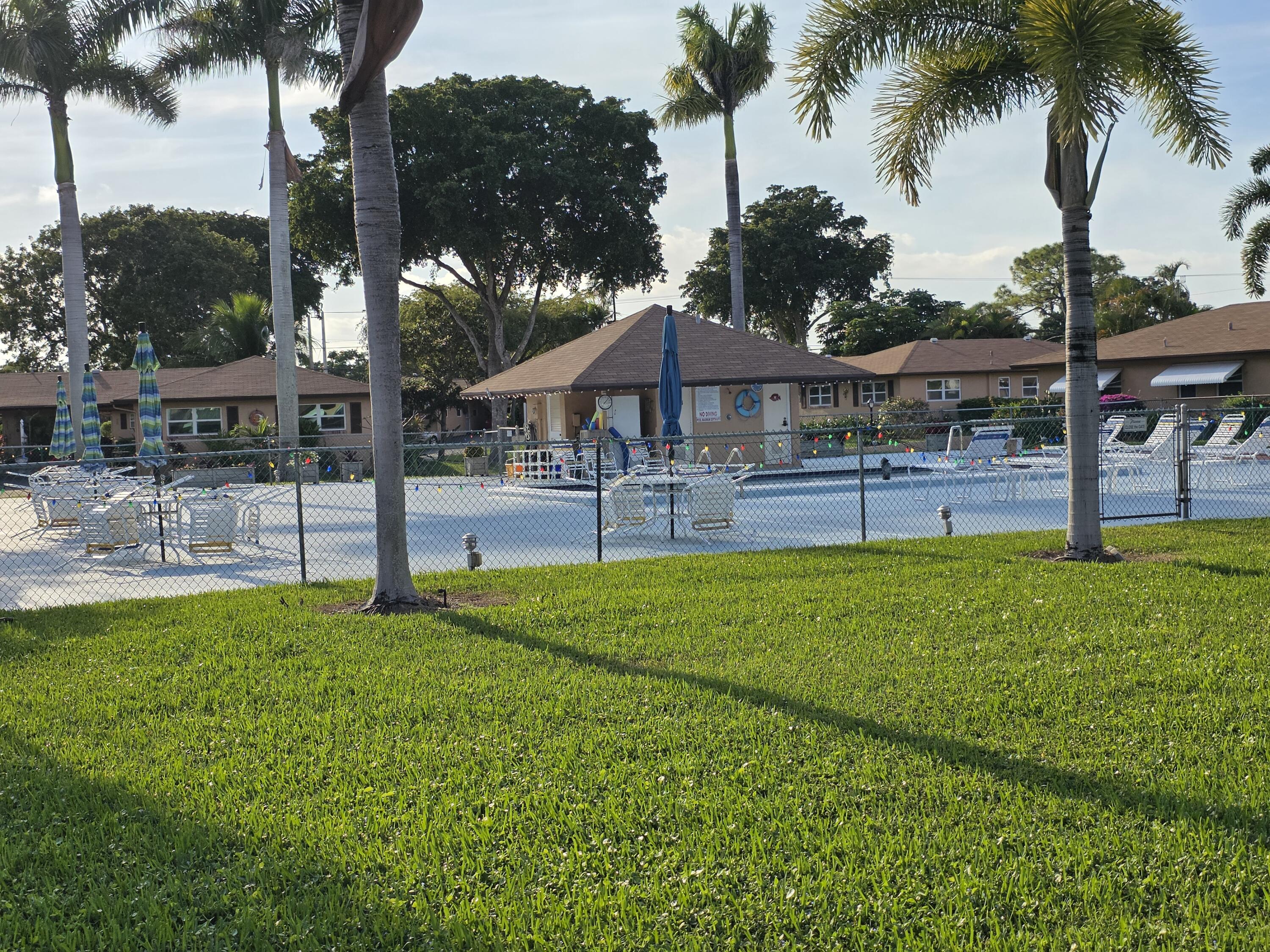 718 Whippoorwill Lane Delray Beach, FL 33445 - Photo 35 of 37 Pool area