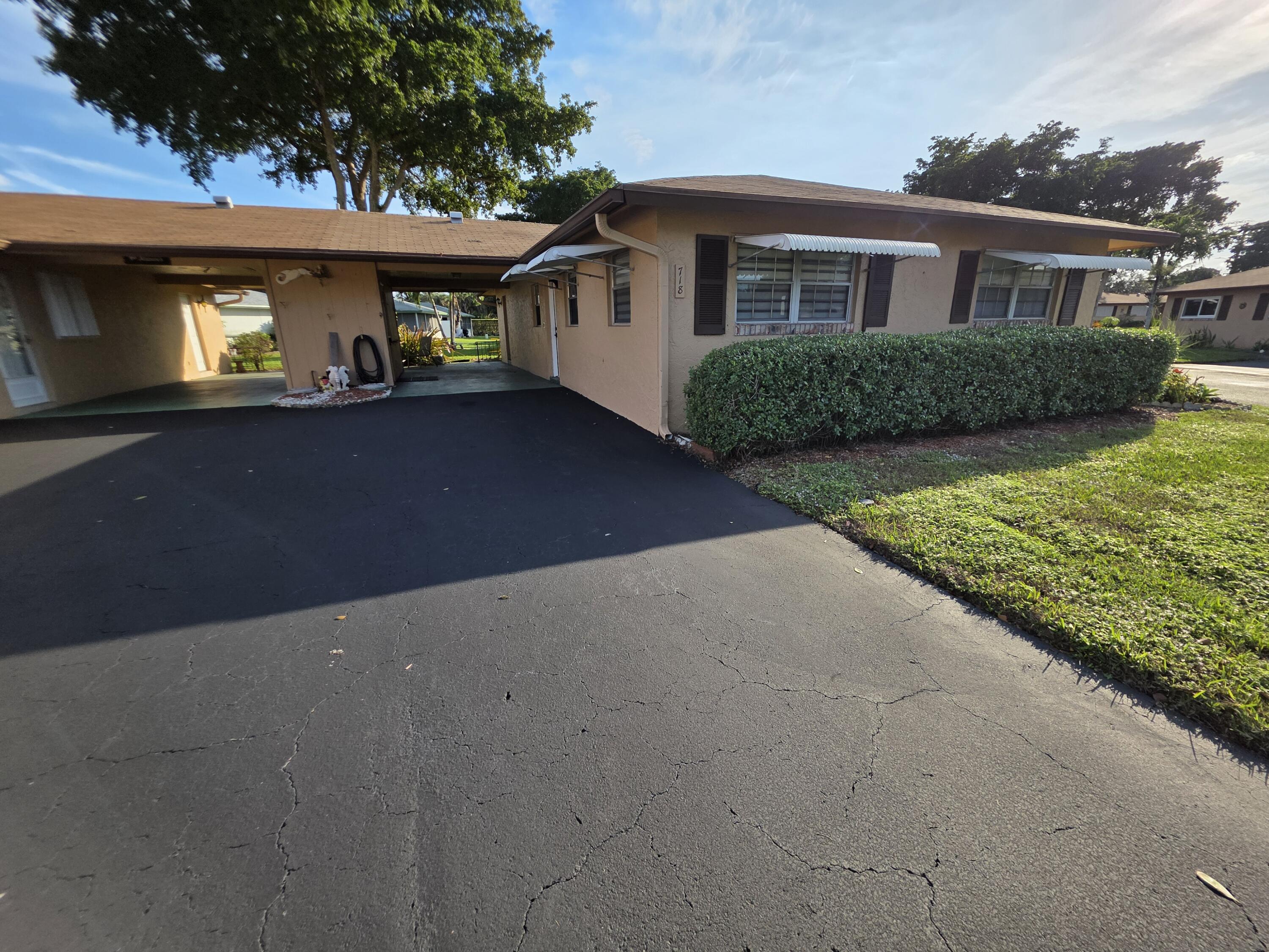 718 Whippoorwill Lane Delray Beach, FL 33445 - Photo 5 of 37 View from driveway