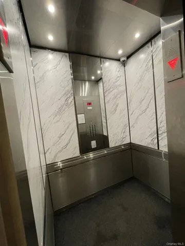 a bathroom with a white bath tub and a shower