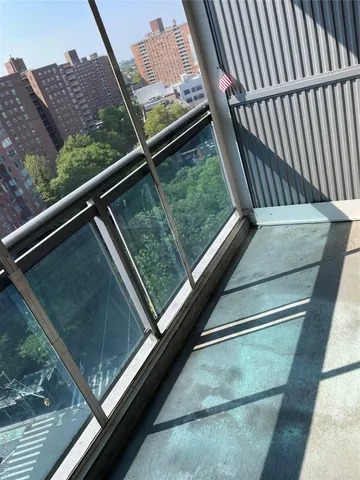 a view of a patio with plants and chairs