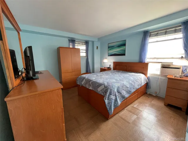 a bedroom with bed and window