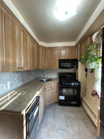 a kitchen with a stove and a refrigerator