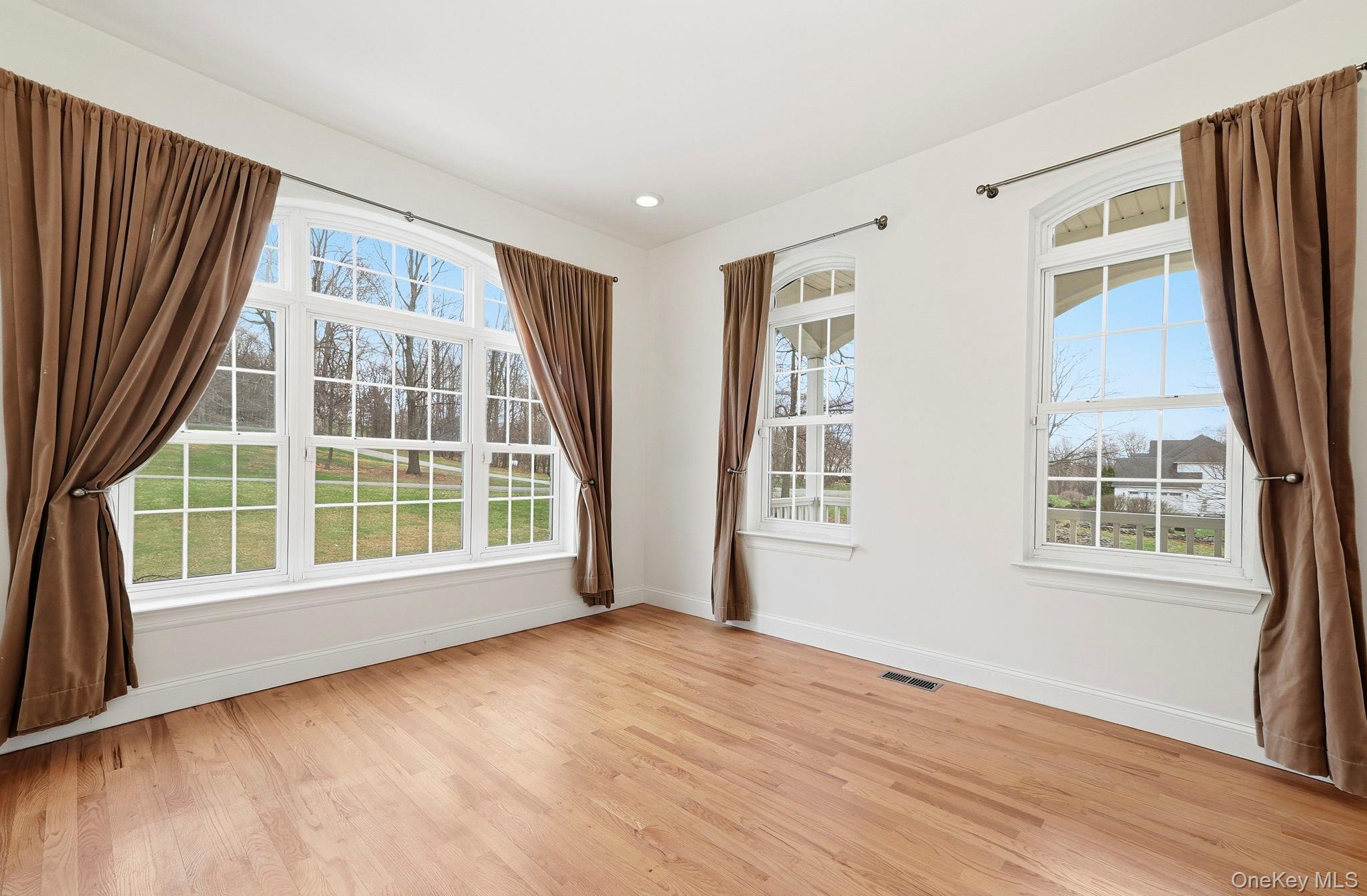 37 Willets Way Newburgh, NY 12550 - Photo 14 of 48 a view of an empty room with a window and wooden floor