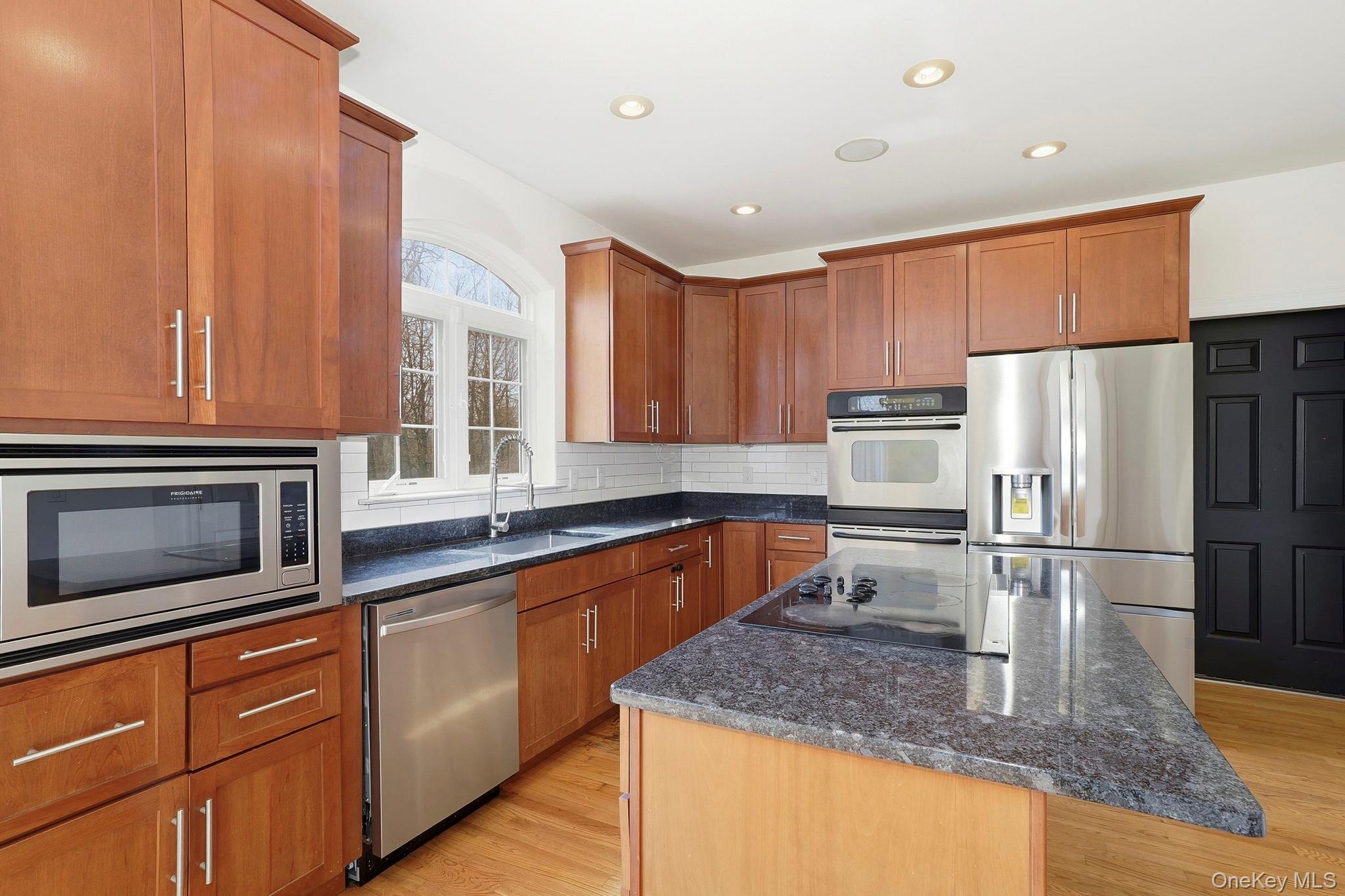 37 Willets Way Newburgh, NY 12550 - Photo 18 of 48 a kitchen with stainless steel appliances granite countertop a sink stove and refrigerator
