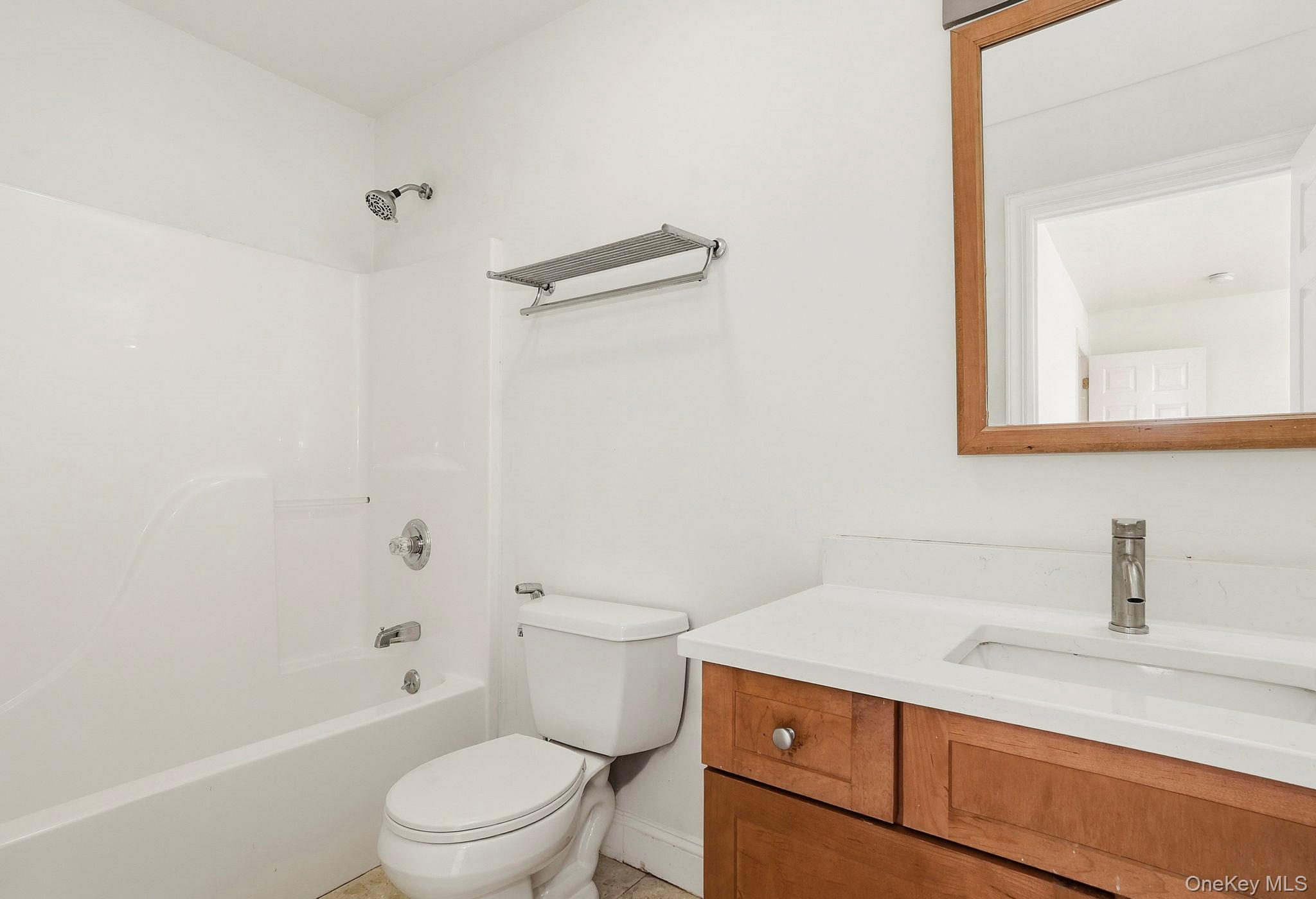 37 Willets Way Newburgh, NY 12550 - Photo 22 of 48 a bathroom with a sink a toilet and shower