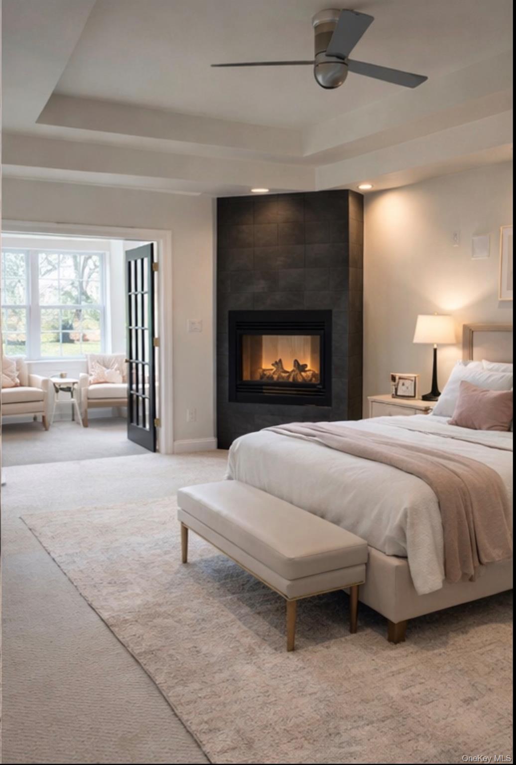 37 Willets Way Newburgh, NY 12550 - Photo 24 of 48 a spacious bedroom with a bed and a fireplace