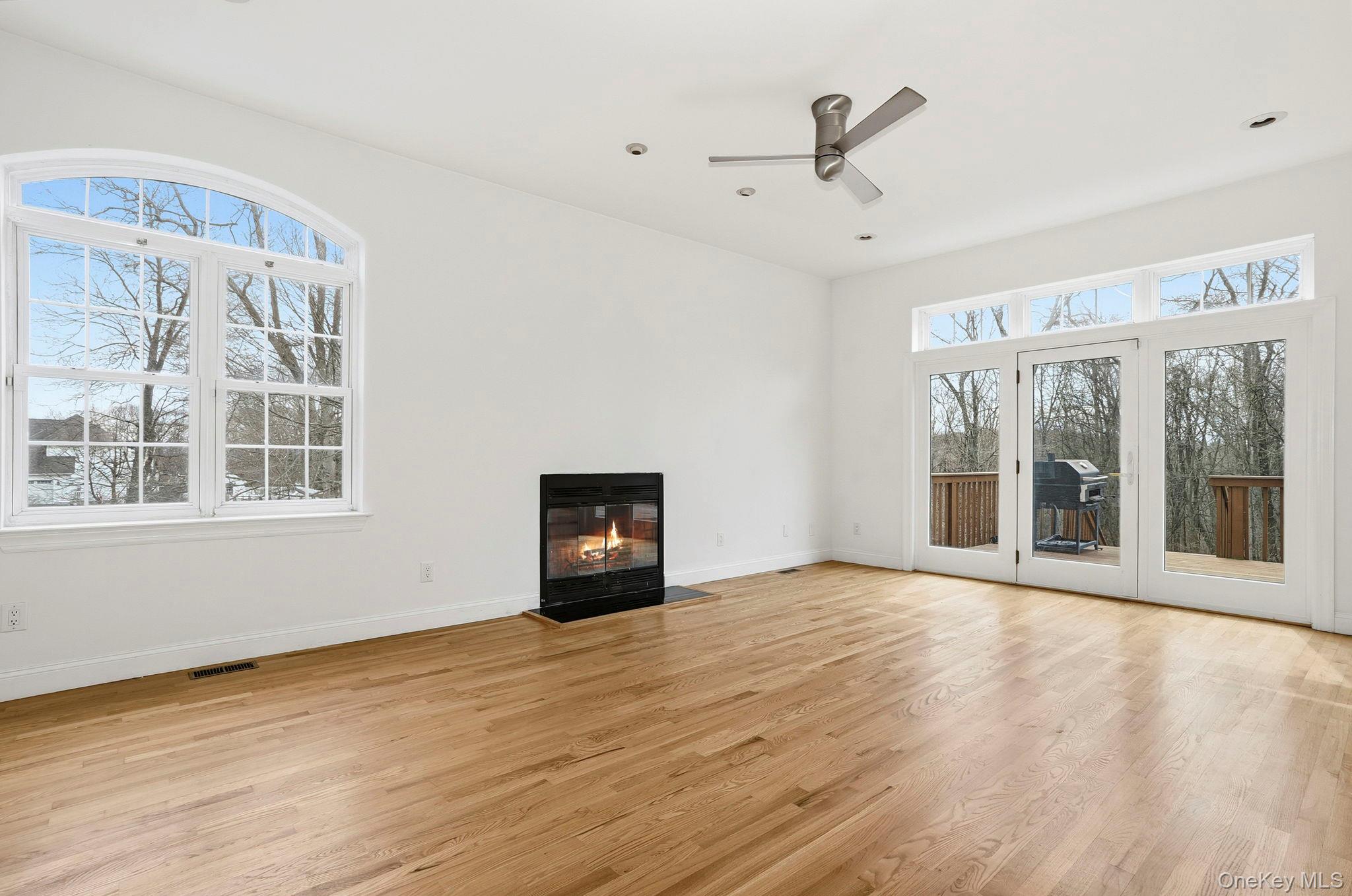 37 Willets Way Newburgh, NY 12550 - Photo 8 of 48 a view of an empty room with wooden floor and a window