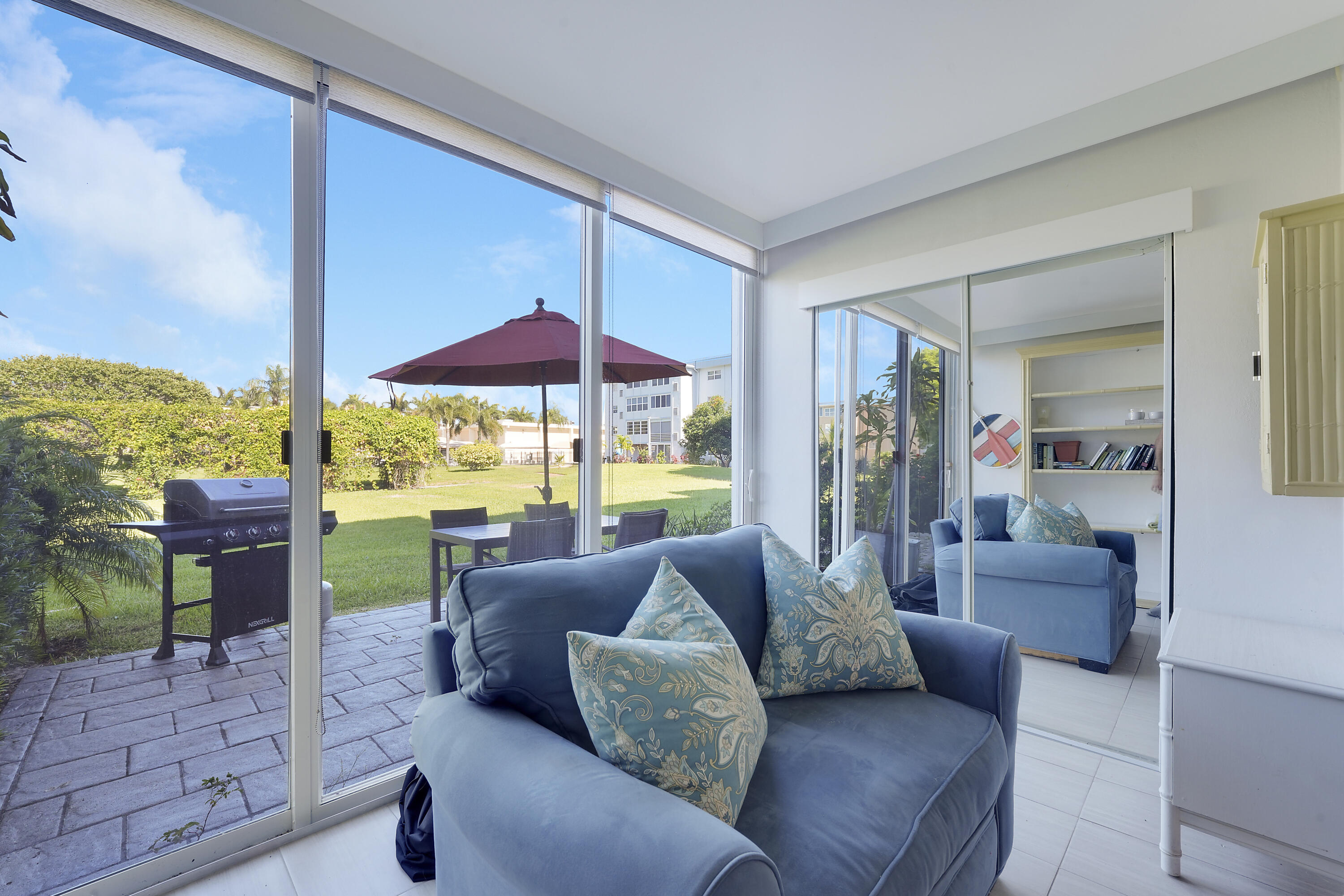 2400 Northeast 1st Lane, Unit 1020 Boynton Beach, FL 33435 - Photo 11 of 34 a living room with furniture and a floor to ceiling window