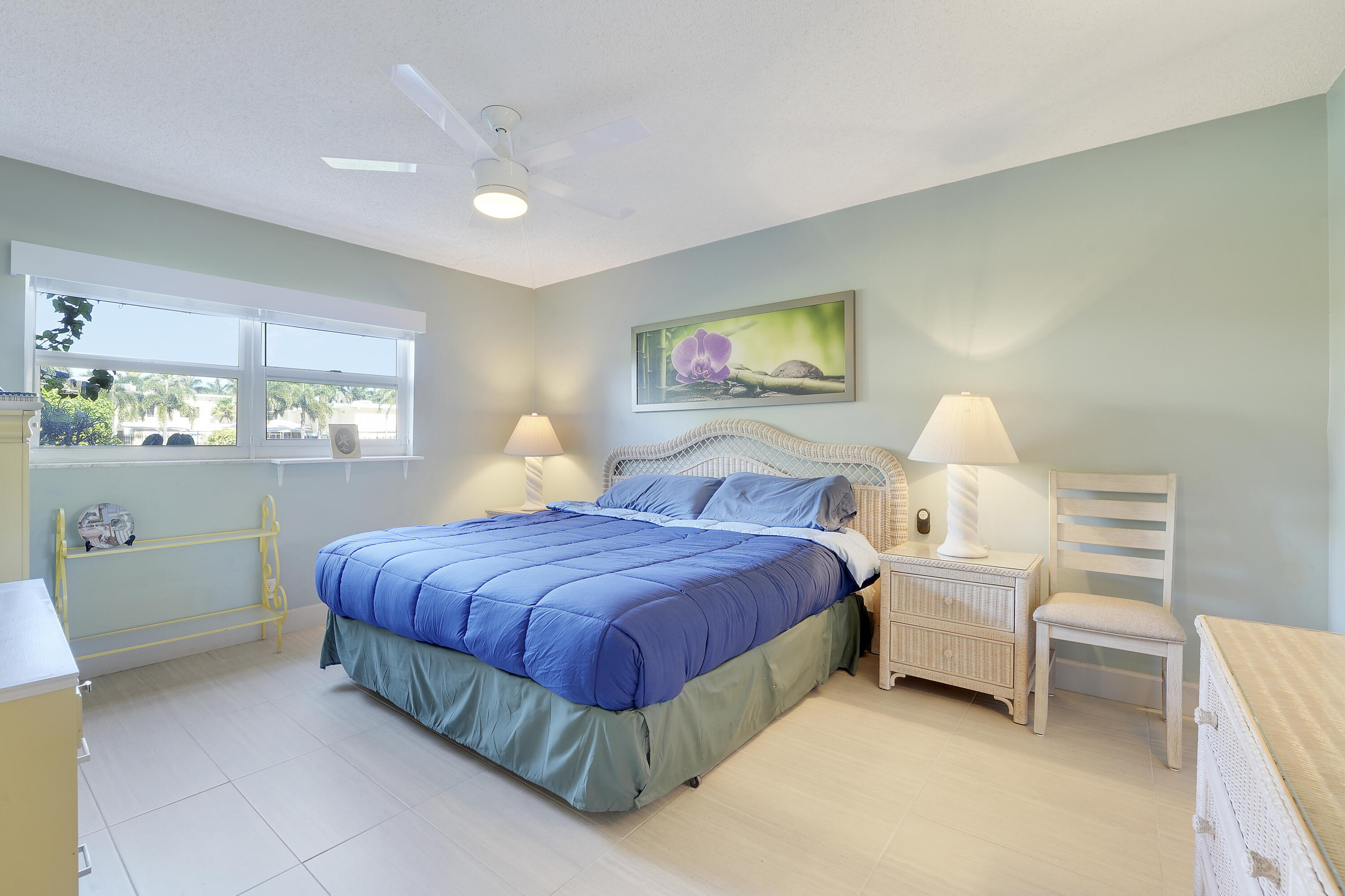 2400 Northeast 1st Lane, Unit 1020 Boynton Beach, FL 33435 - Photo 16 of 34 a bedroom with a bed and window