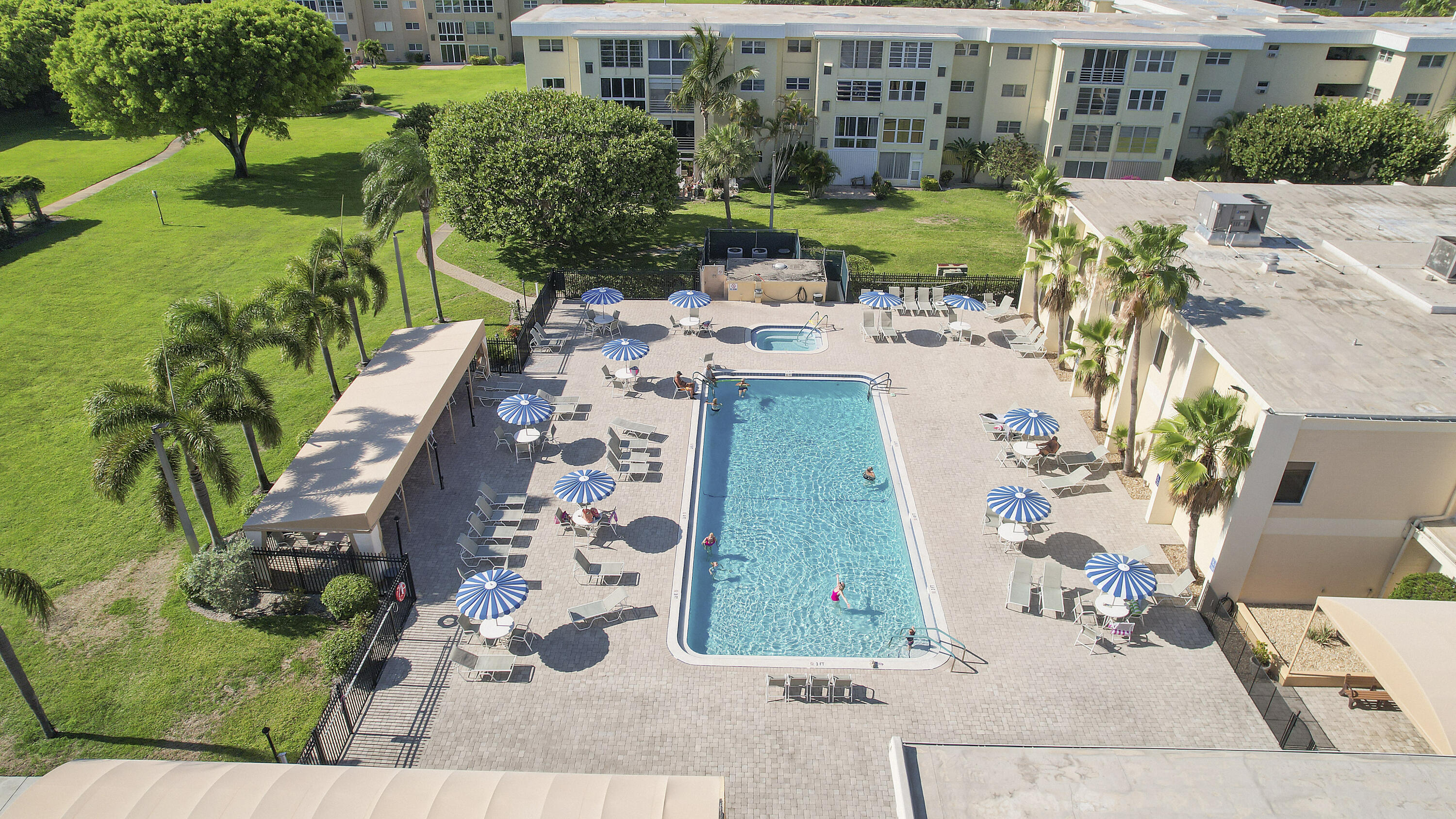 2400 Northeast 1st Lane, Unit 1020 Boynton Beach, FL 33435 - Photo 21 of 34 a view of a backyard with plants and outdoor seating