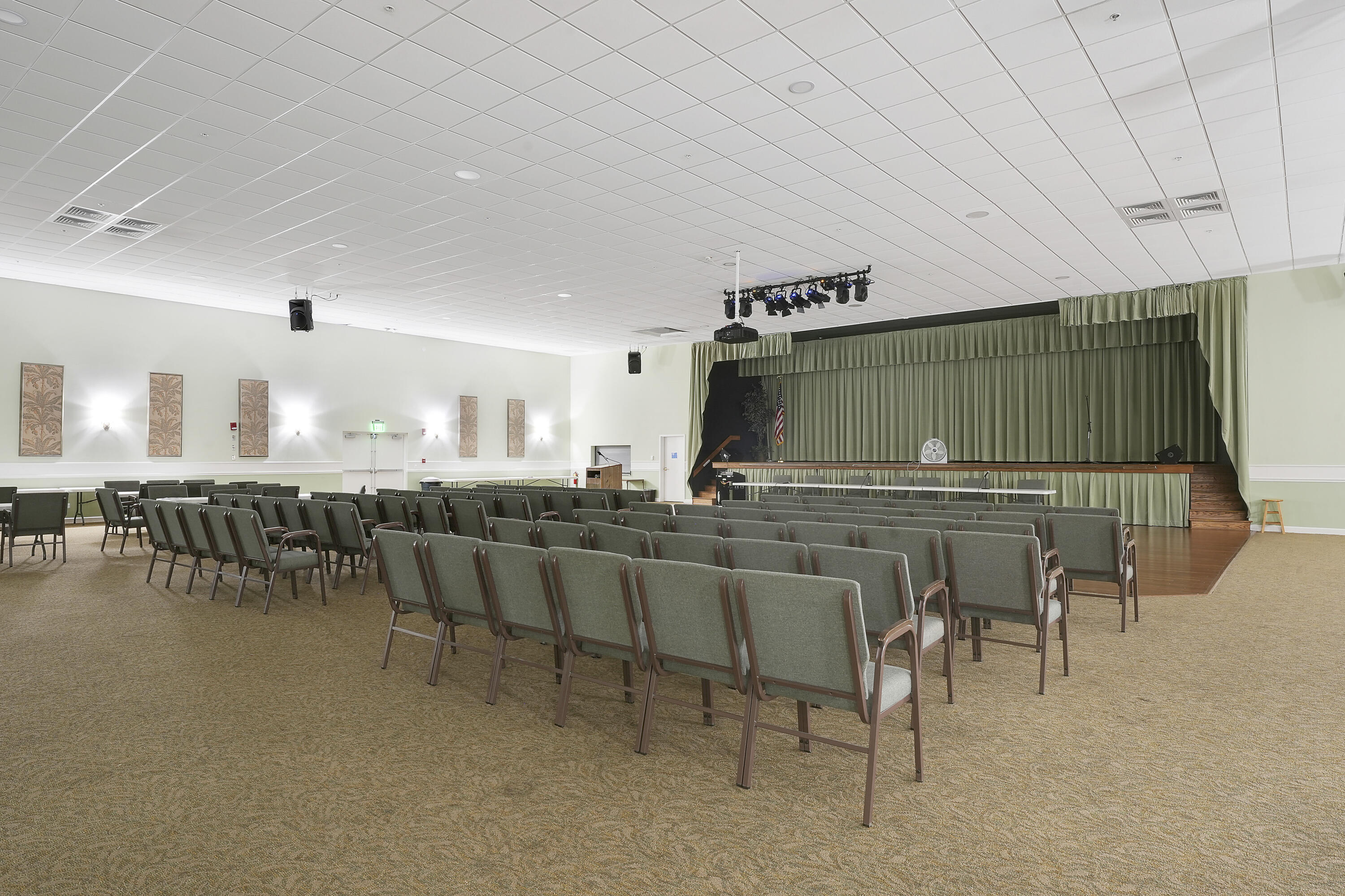 2400 Northeast 1st Lane, Unit 1020 Boynton Beach, FL 33435 - Photo 28 of 34 a living room with furniture a flat screen tv and kitchen view