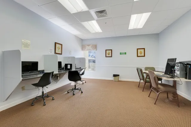 a view of a swimming pool with a yard