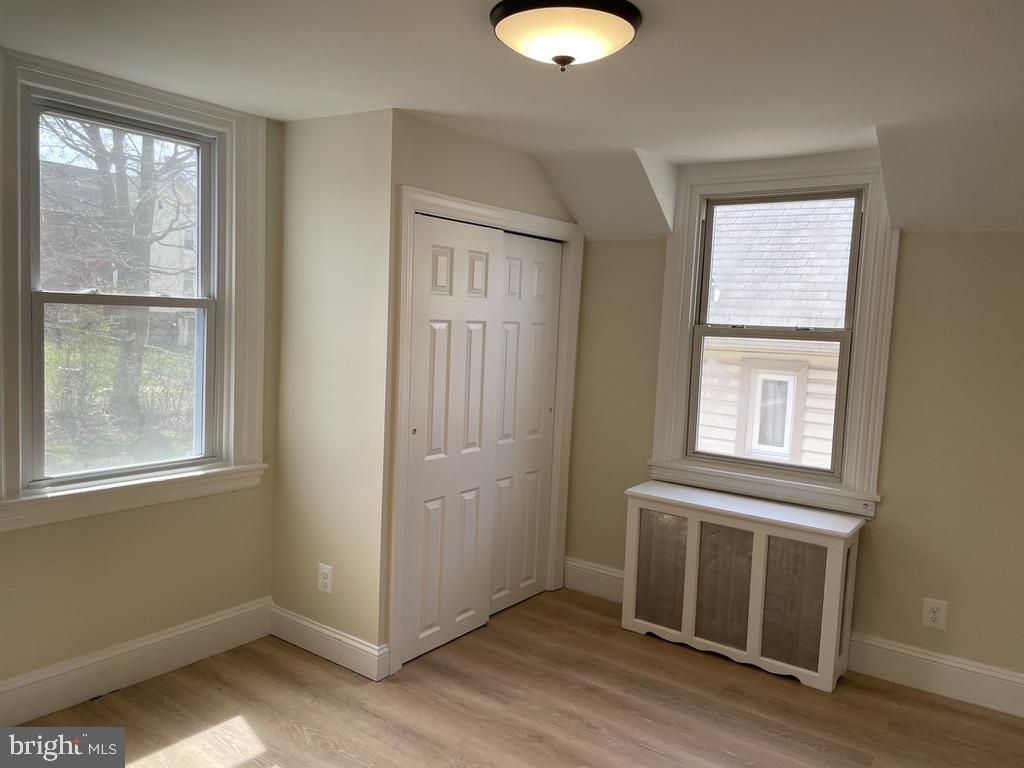 201 Simpson Road Ardmore, PA 19003 - Photo 13 of 37 a view of a livingroom with wooden floor and a window
