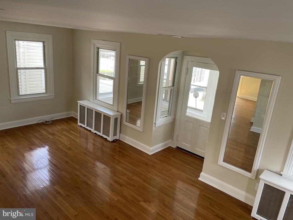 201 Simpson Road Ardmore, PA 19003 - Photo 22 of 37 an empty room with wooden floor and windows