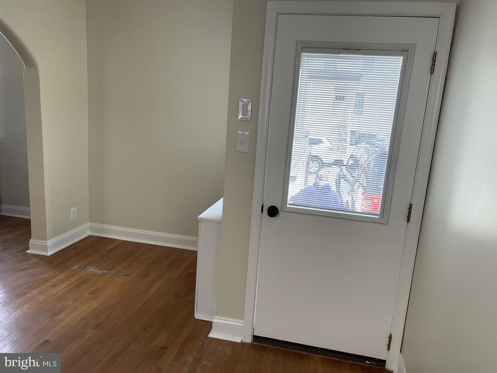 201 Simpson Road Ardmore, PA 19003 - Photo 27 of 37 an empty room with wooden floor and windows