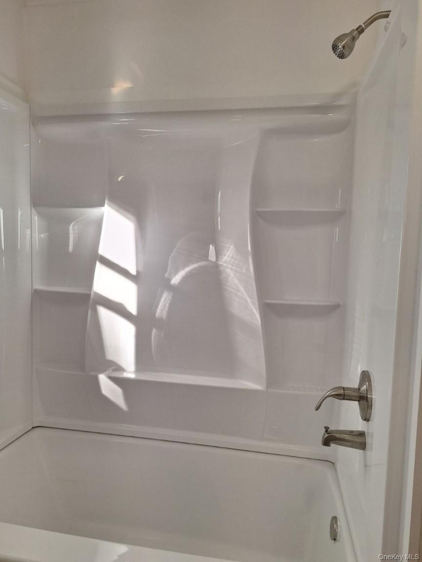 652 Highway 211, Unit 1 Middletown, NY 10940 - Photo 11 of 18 a bathroom with a shower
