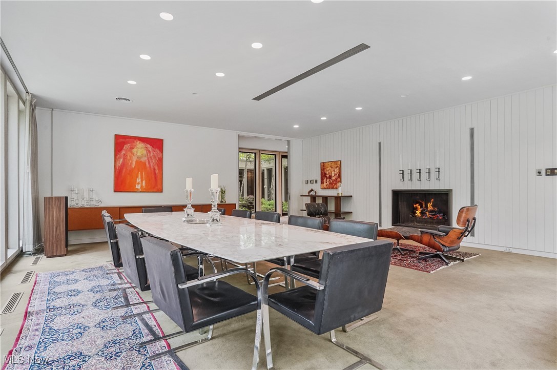 3210 North Dover Road Stow, OH 44224 - Photo 13 of 44 Dining space featuring recessed lighting and a lit fireplace