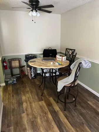 a living room with couches and a flat screen tv