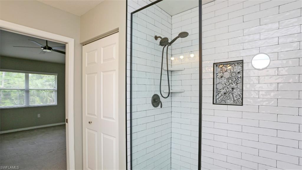 6645 Huntington Lakes Circle, Unit 201 Naples, FL 34119 - Photo 23 of 48 Bathroom featuring tiled shower