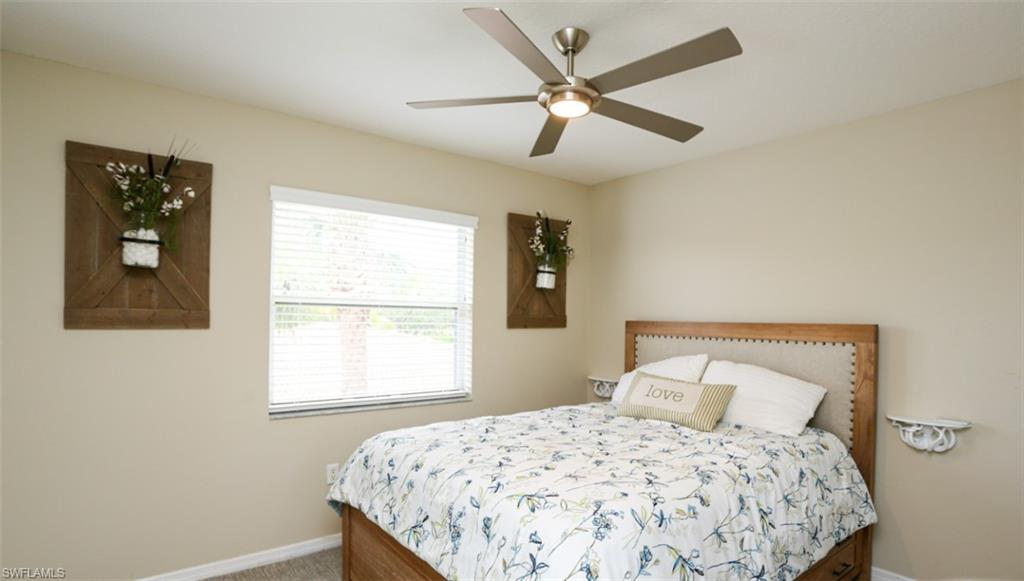 6645 Huntington Lakes Circle, Unit 201 Naples, FL 34119 - Photo 24 of 48 Bedroom featuring ceiling fan