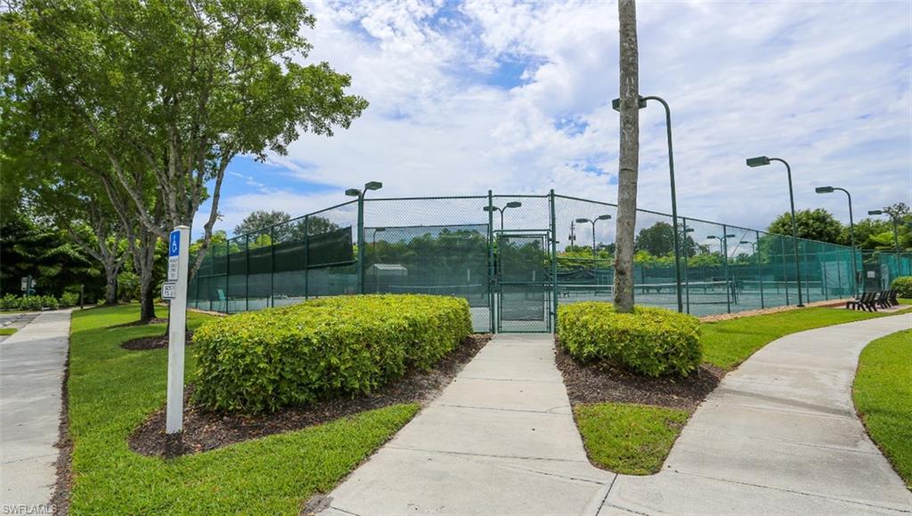 6645 Huntington Lakes Circle, Unit 201 Naples, FL 34119 - Photo 38 of 48 Surrounding community with tennis court