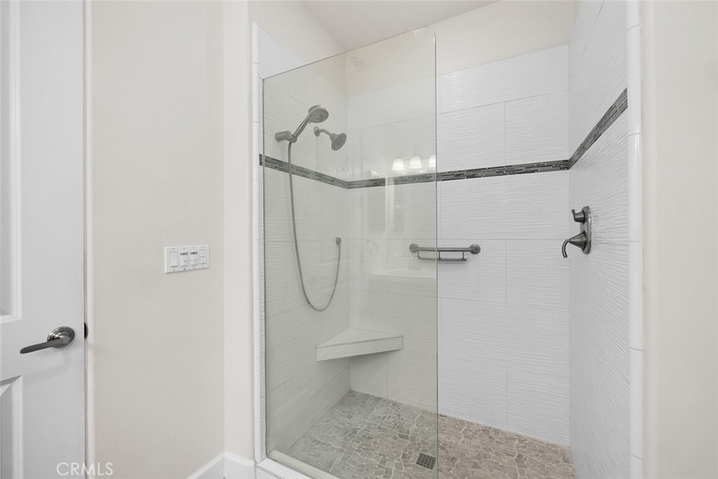1189 Swallowtail Way Nipomo, CA 93444 - Photo 18 of 40 Stylish, remodeled walk-in shower for downstairs bedroom.