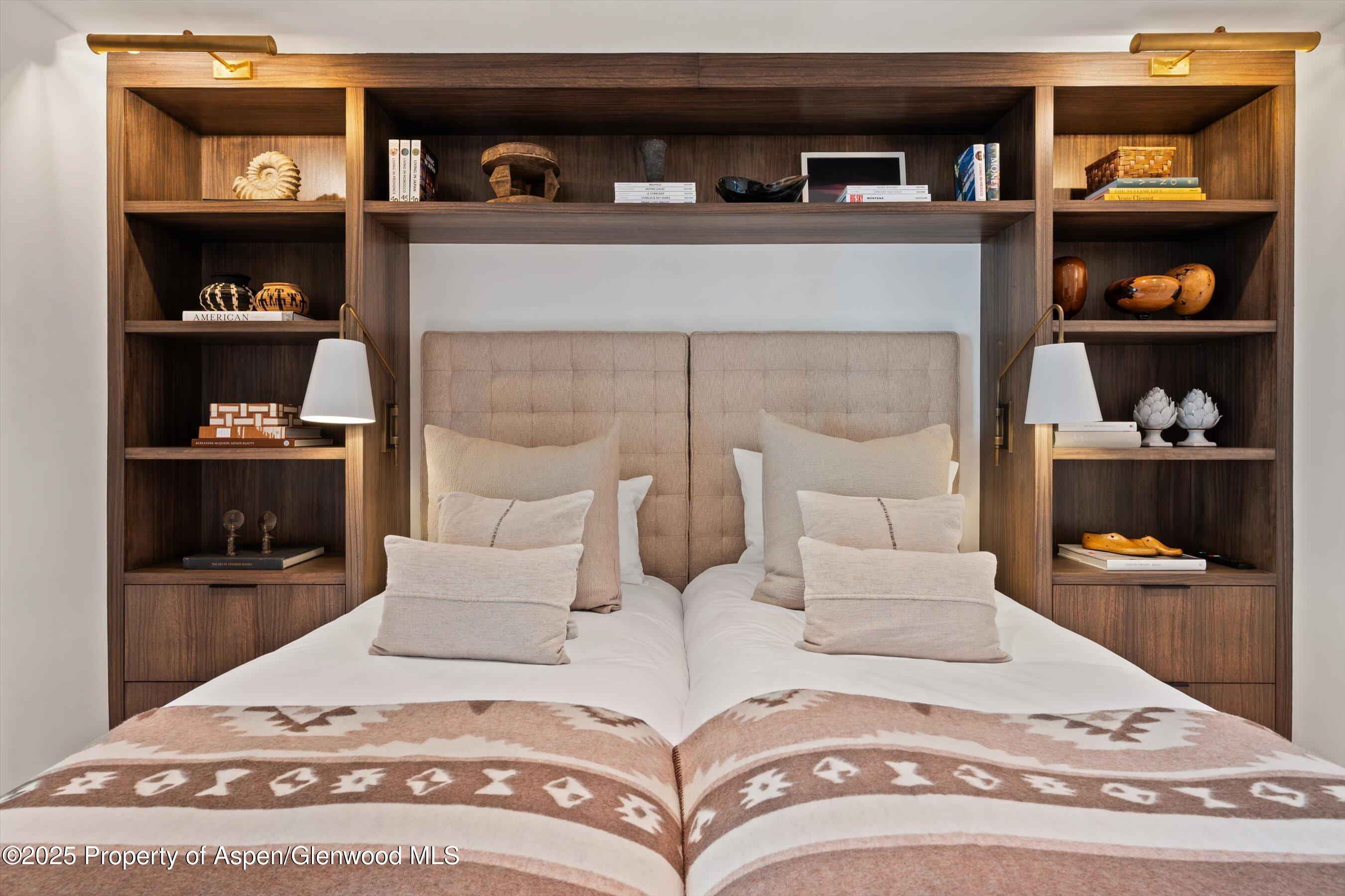 155 Lone Pine Road, Unit 12 Aspen, CO 81611 - Photo 15 of 37 a bedroom with a bed and closet