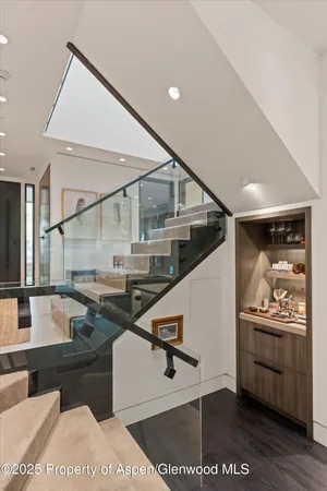 a bedroom with a large window and a bed